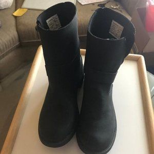 pair of Gray/lack suede boots.